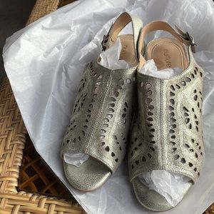 Nurture women's Sandals gold size 10 heel  is 1 1/2” leather upper and liner